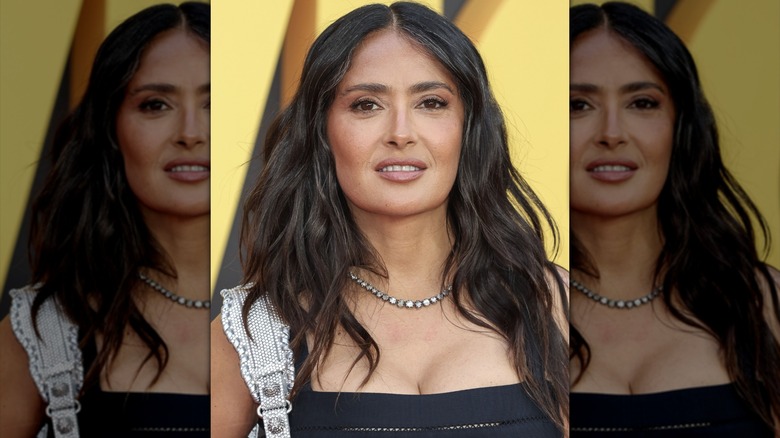 Salma Hayek posing with her grays showing