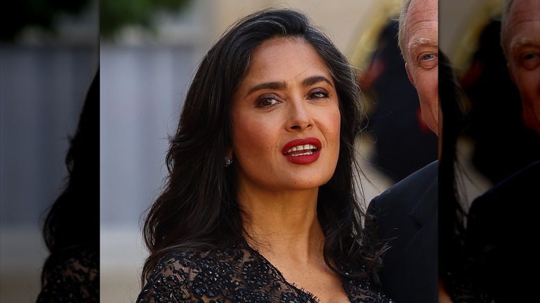 Salma Hayek with her grays showing and red lips