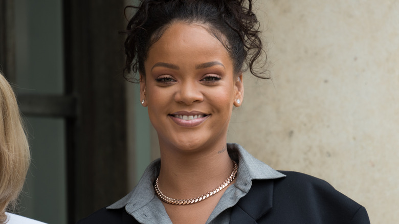 Rihanna wearing a button-up shirt