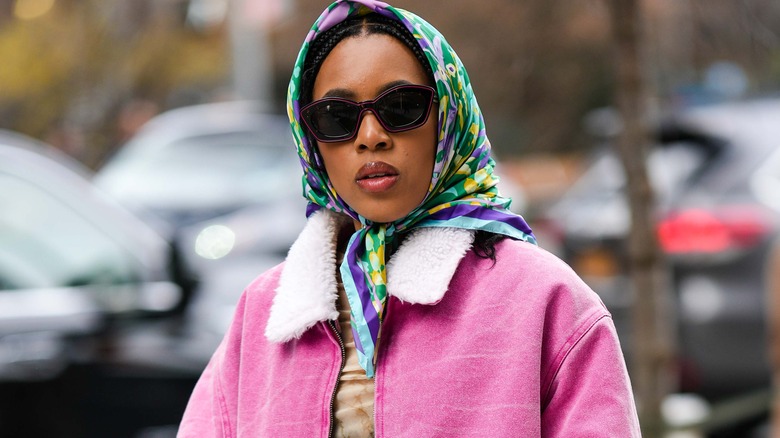 multi-colored head scarf with a fur pink jacket