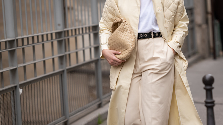 close-up of white trousers and coat