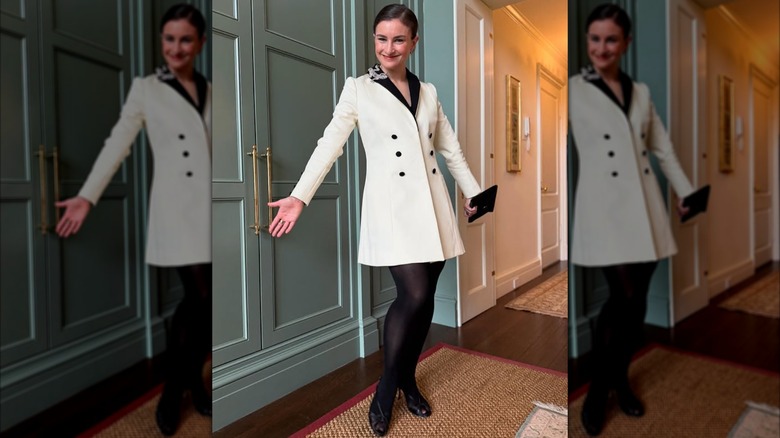 Chloe Malle poses in a white button-up dress.