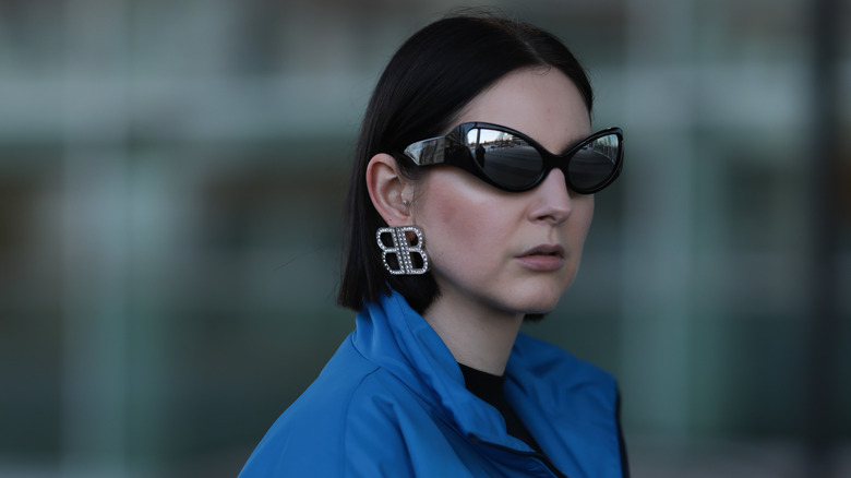 woman wearing silver earrings