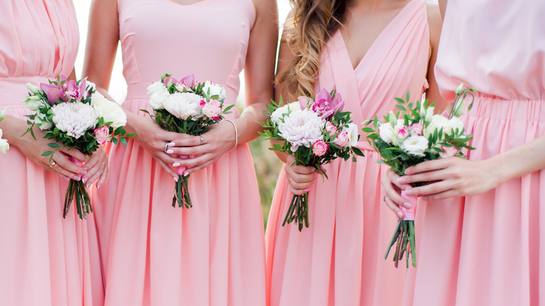 bridesmaids holding bouquets