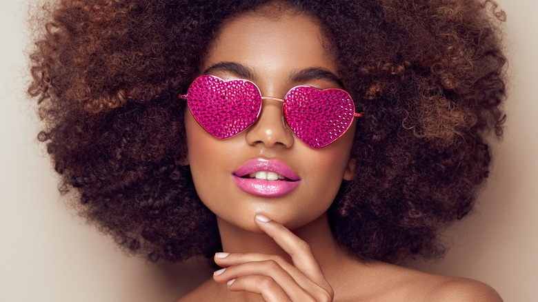 woman wearing heart shaped glasses