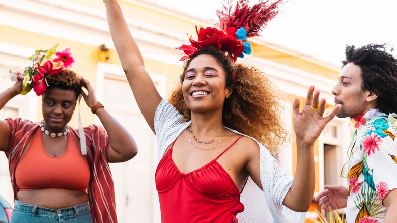 Young woman dancing carefree outside