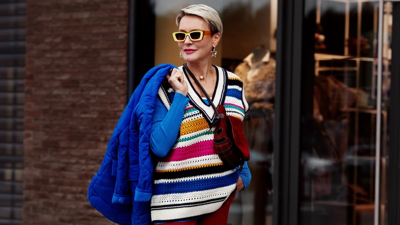 woman wearing a multi-colored sweater