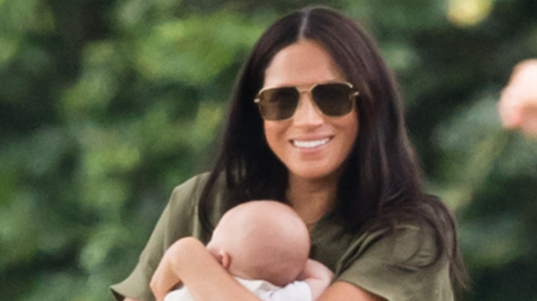 Meghan Markle smiling and waving