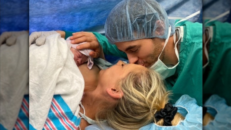Enrique Iglesias kisses Anna Kournikova after the birth of their child
