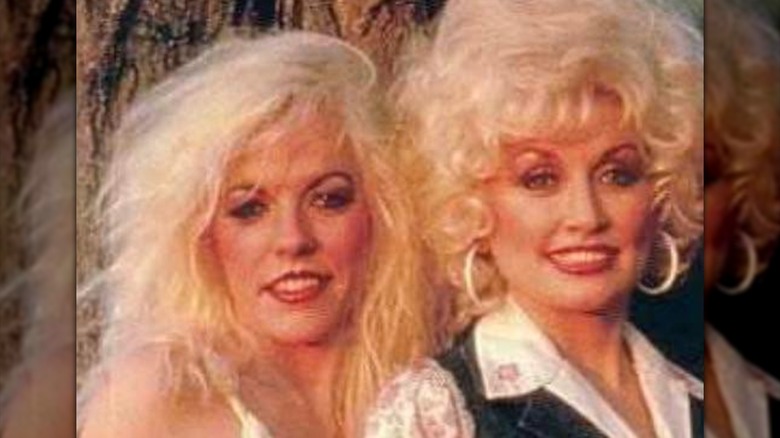 Freida Parton and Dolly Parton are photographed together back in the day with matching bleach-blond hair.