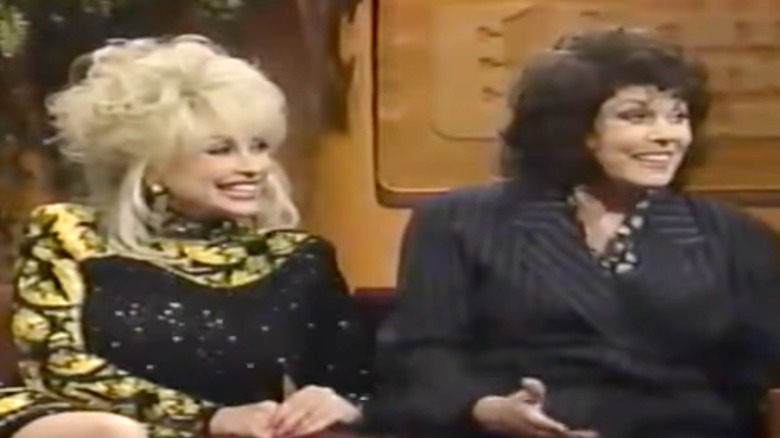 Dolly Parton and her sister Willadeene are pictured during a talk show appearance together in 1996.