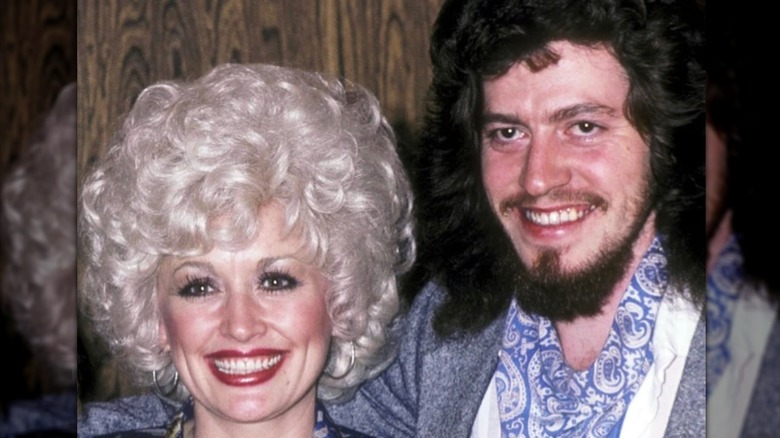 A throwback photo shows Dolly Parton and brother Floyd Parton smiling together.
