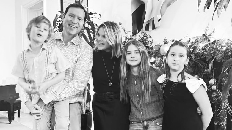 Jenna Bush Hager smiling alongside Hal, Henry, Mila and Poppy Hager in a black-and-white photo.