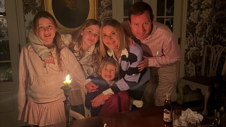 Jenna Bush Hager hugging her kids with Henry Hager over a candlelight dinner.
