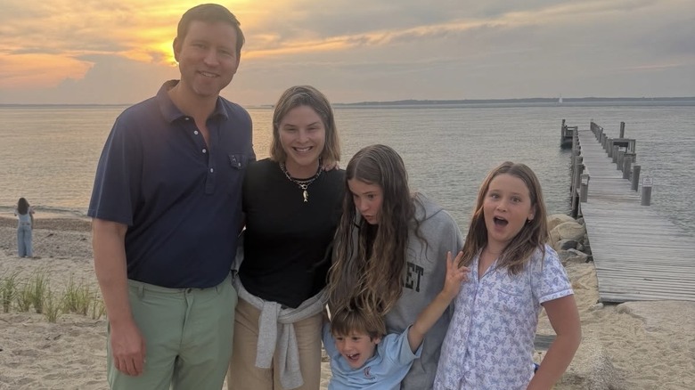 Henry Hager, Jenna Bush Hager, and their kids, Mila, Poppy, and Hal at the beach at sunset.