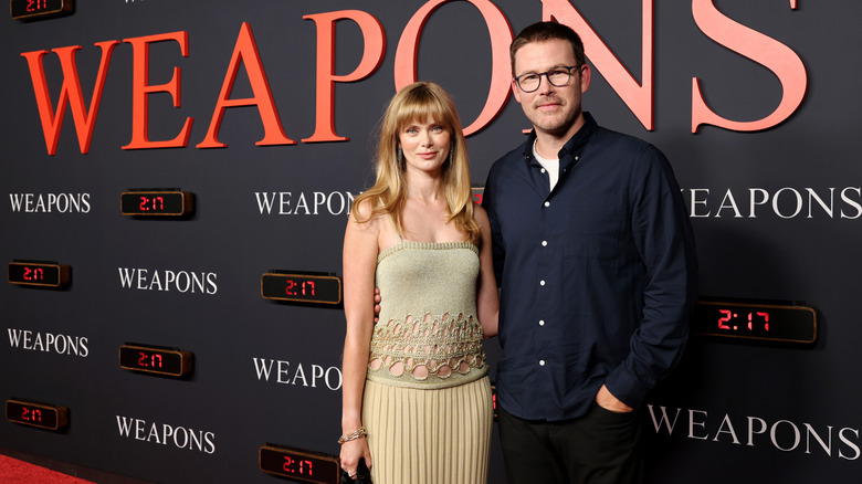 Sara Paxton smiles with Zach Cregger on the red carpet