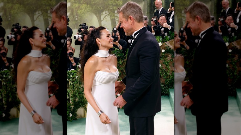 Luciana Barroso and Matt Damon smile at each other at the 2024 Met Gala