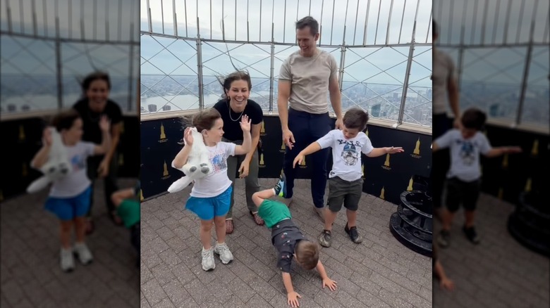 Shawn Johnson, Andrew East, and their kids at the Empire State Building