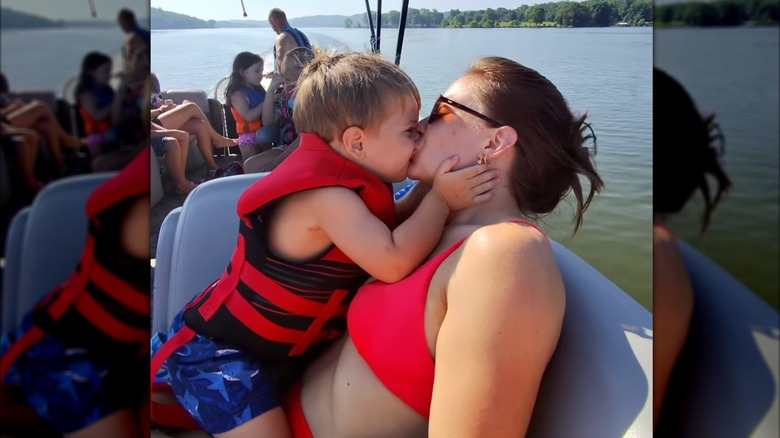 Shawn Johnson kisses her son Barrett on the lake