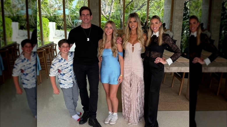 Brayden, Tarek El Moussa, Taylor, Christina Haack, and Heather Rae El Moussa pose together indoors in formal outfits.