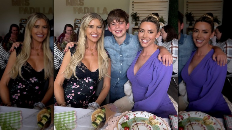 Christina Haack, Brayden, and Heather Rae El Moussa smiling for a photo in a restaurant.