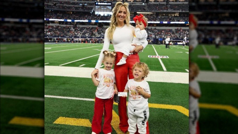 Brittany Mahomes with the kids at a football game in Texas