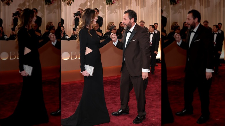 Jackie Sandler holds hands with Adam Sandler