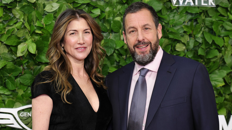 Jackie Sandler and Adam Sandler smile together