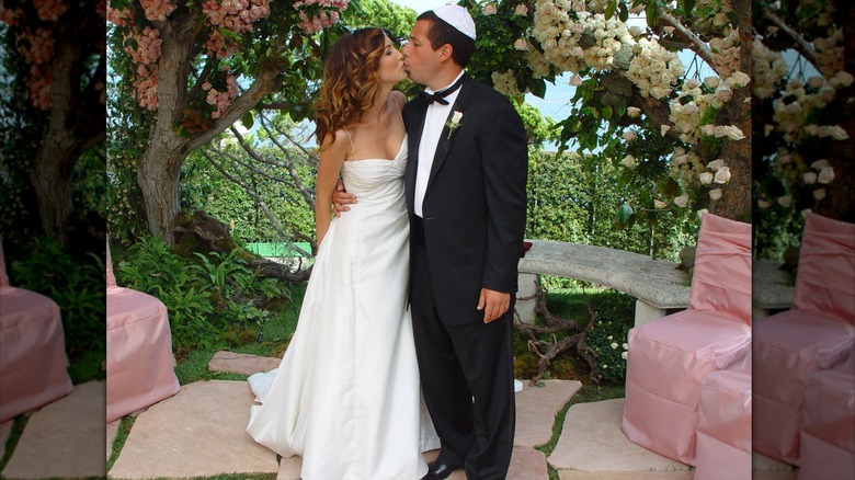 Jackie Sandler and Adam Sandler kiss on their wedding day