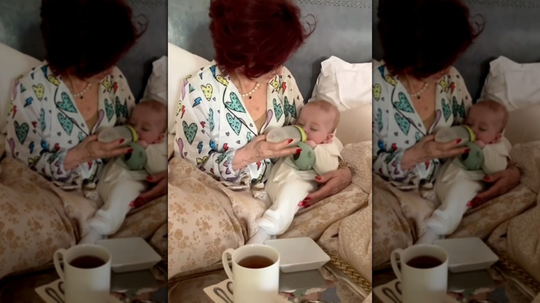Sharon Osbourne feeding her grandson Sidney