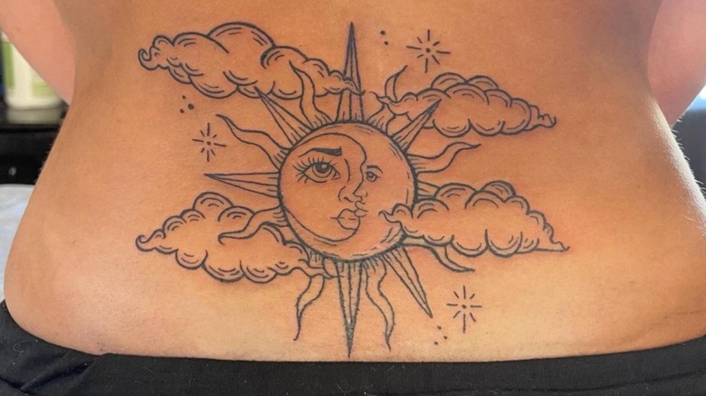 sun moon lower back tattoo