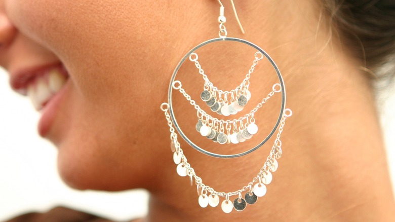 woman wearing chandelier earrings