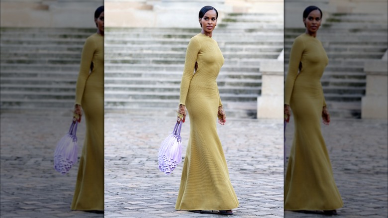 Sabrina Dhowre Elba carrying tasseled handbag