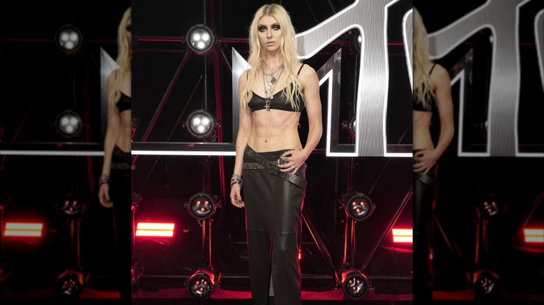 Taylor Momsen in a black bralette