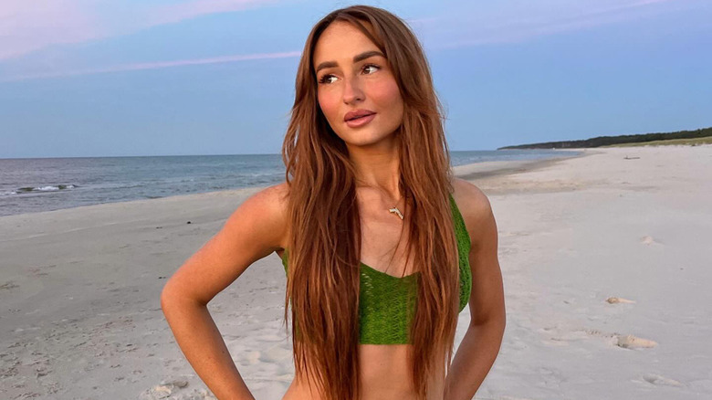 Red hair green top