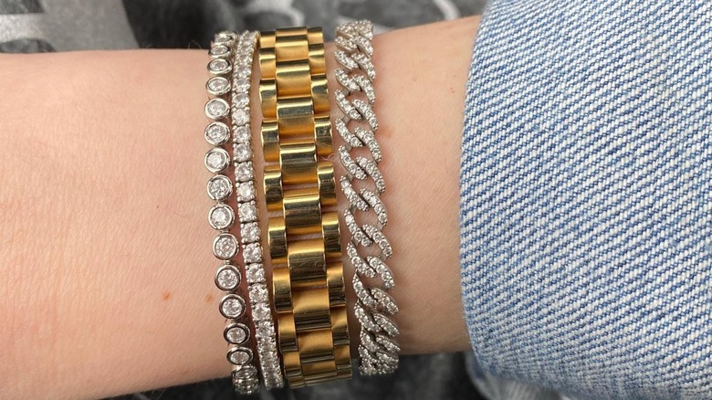 Woman wearing two diamond bracelets