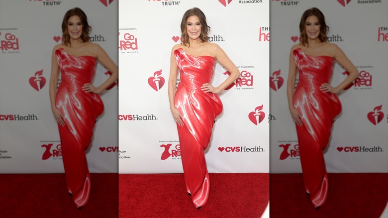Teri Hatcher in a red strapless structural gown