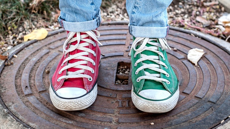 Wearing red and green Converse All Stars