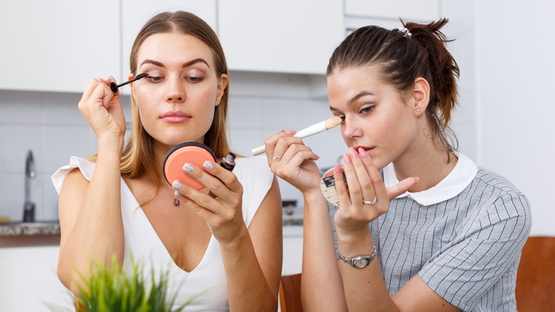 women doing makeup