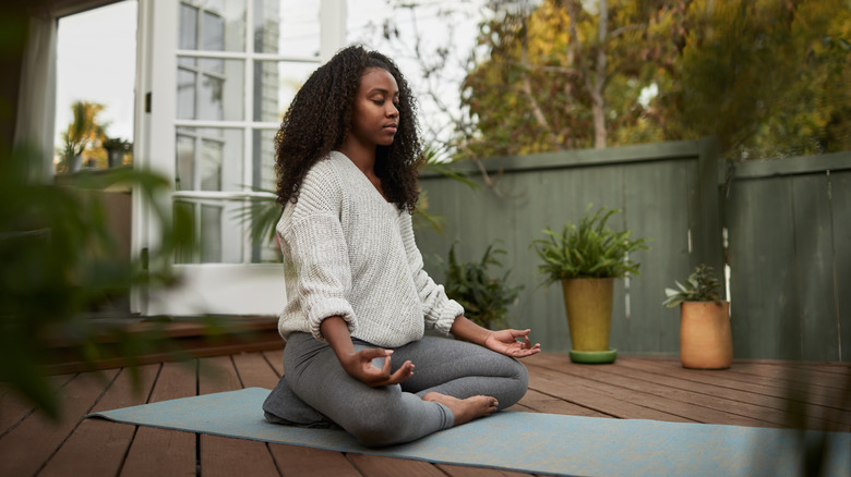 Woman meditating outside