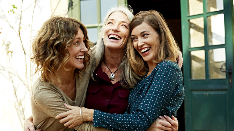 Three women hugging