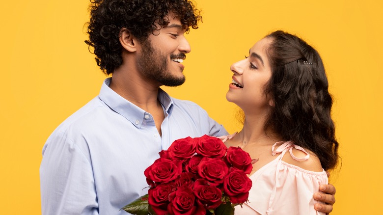 couple with bouquet of roses