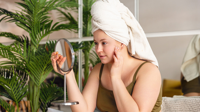 Girl looking in the mirror