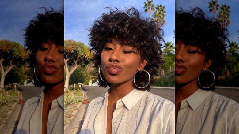 woman with curly chopped hair