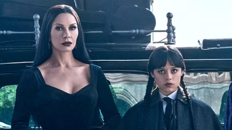 Catherine Zeta-Jones and Jenna Ortega in character as Morticia and Wednesday Addams