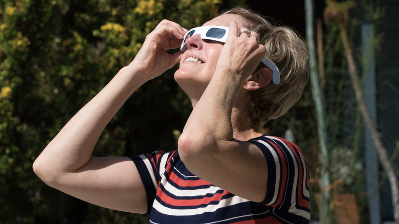 Woman watching solar eclipse