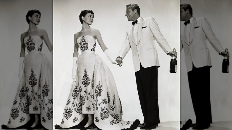 Publicity handout from the 1954 film, "Sabrina." In this studio recreation of one of the movie's scenes, Audrey Hepburn and William Holden get into character as the ugly duckling-turned-beauty queen Sabrina Fairchild and charming millionaire playboy Linus Larrabee, respectively.