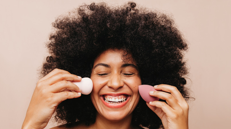 woman blending makeup