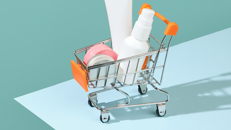 Small shopping cart holds skin care bottles