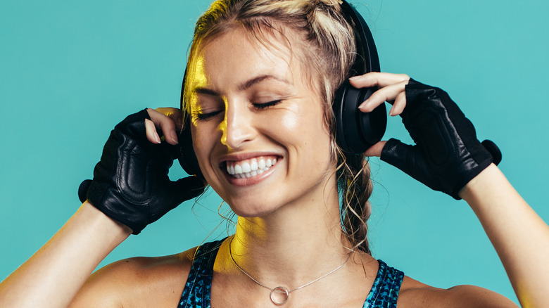 woman in workout clothes with headphones